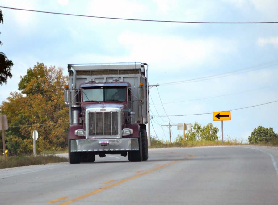 A color photo of an Ag CMV operating on a road. These farm vehicles may be eligible to use dyed fuels.