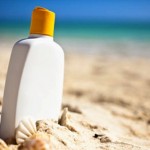 bottle of sunscreen on a beach