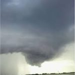 tornado forming in dark gray sky