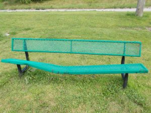 Broken green park bench