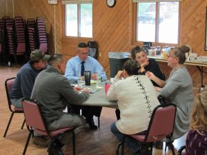 A group of county leaders meeting about policy changes