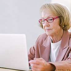woman looking at her computer