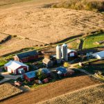 View of farm surrounded by fields