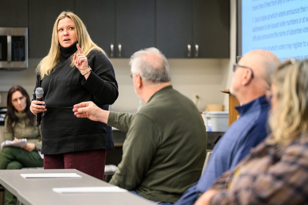 As a municipal clerk specialist and education specialist with the Division of Extension, professor Melissa Kono travels the state to support election training efforts. Here, she leads the Waushara & Waupaca County Election Inspector Training at the Waushara County Government Center