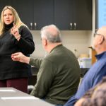 As a municipal clerk specialist and education specialist with the Division of Extension, professor Melissa Kono travels the state to support election training efforts. Here, she leads the Waushara & Waupaca County Election Inspector Training at the Waushara County Government Center