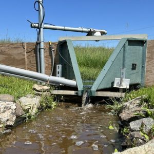 Instruments are set up in a stream to measure water quality 