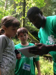 Youth and Upham Naturalist studying image on iPad