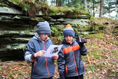 Boys holding digital weather reader