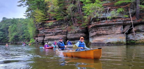 people canoeing along sandstone bluffs on the Wisconsin River