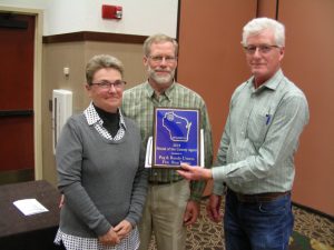 Peg & Randy Urness receiving the Friend of the County Agent Award from Ken Schroeder.